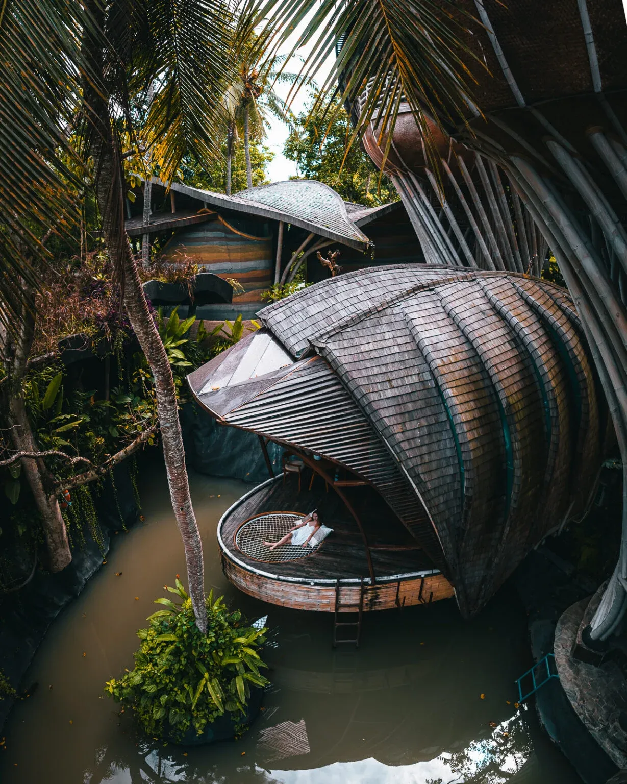 Aerial drone view of the floating lake bamboo villa at Ulaman Bali Eco resort
