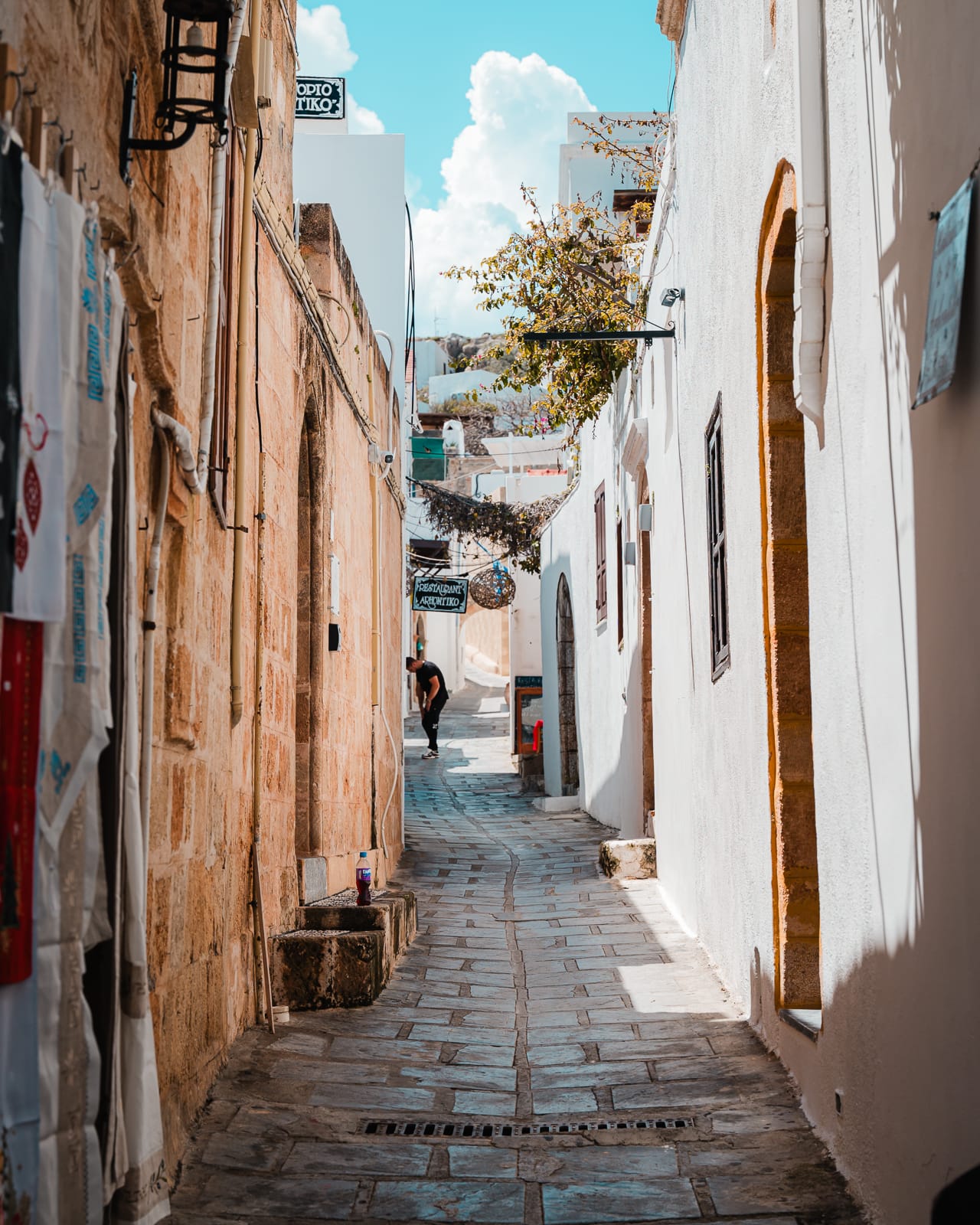whitewashed alley in lindos, greece