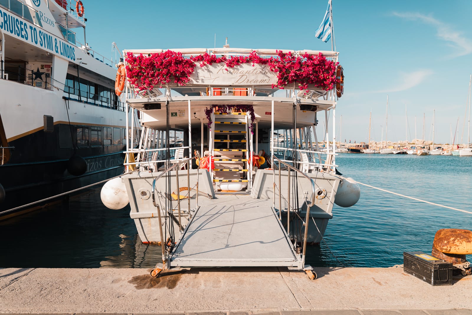 colourful boat floating on water at Mandaraki Harbour in Rhodes