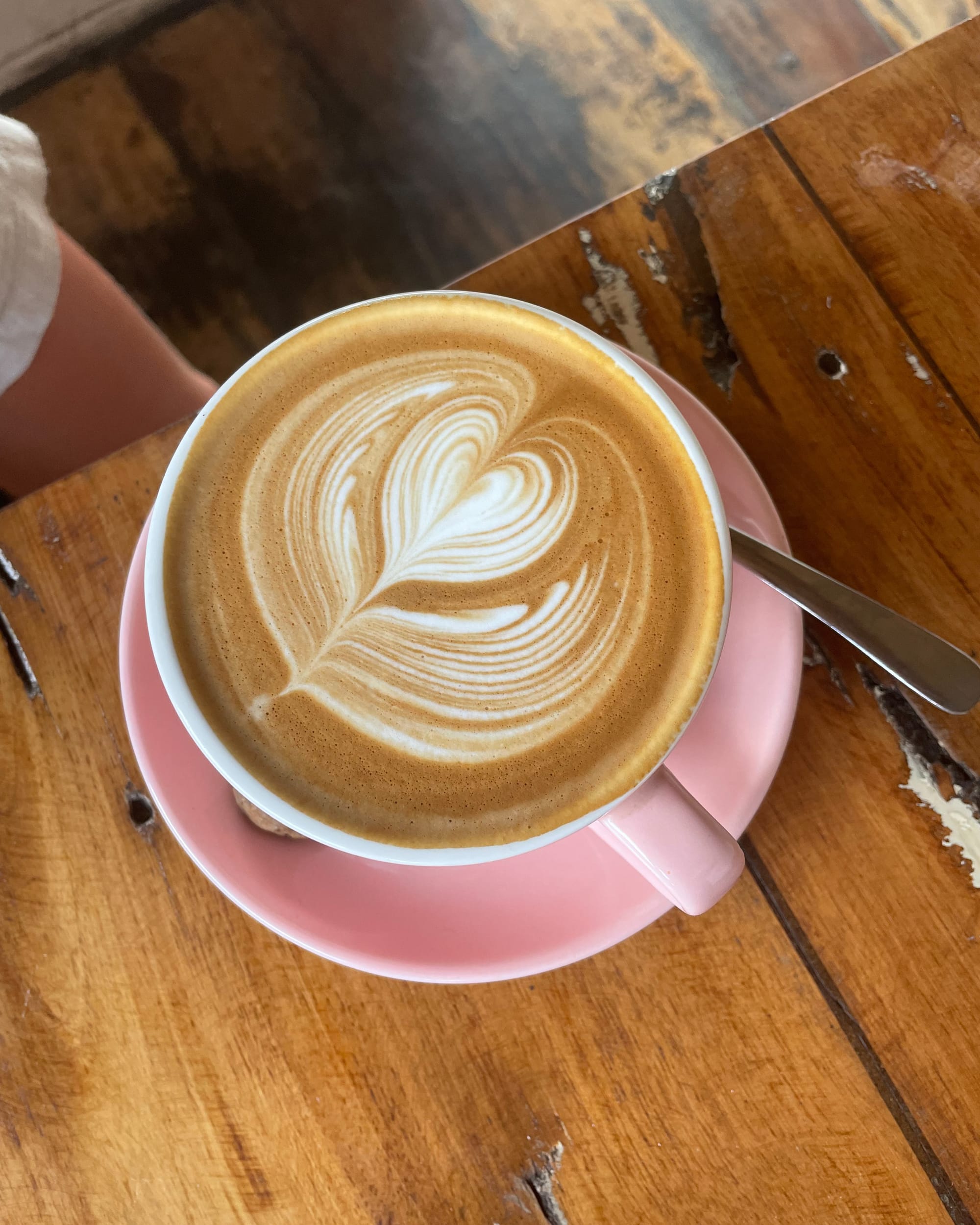 latte art in a pink mug