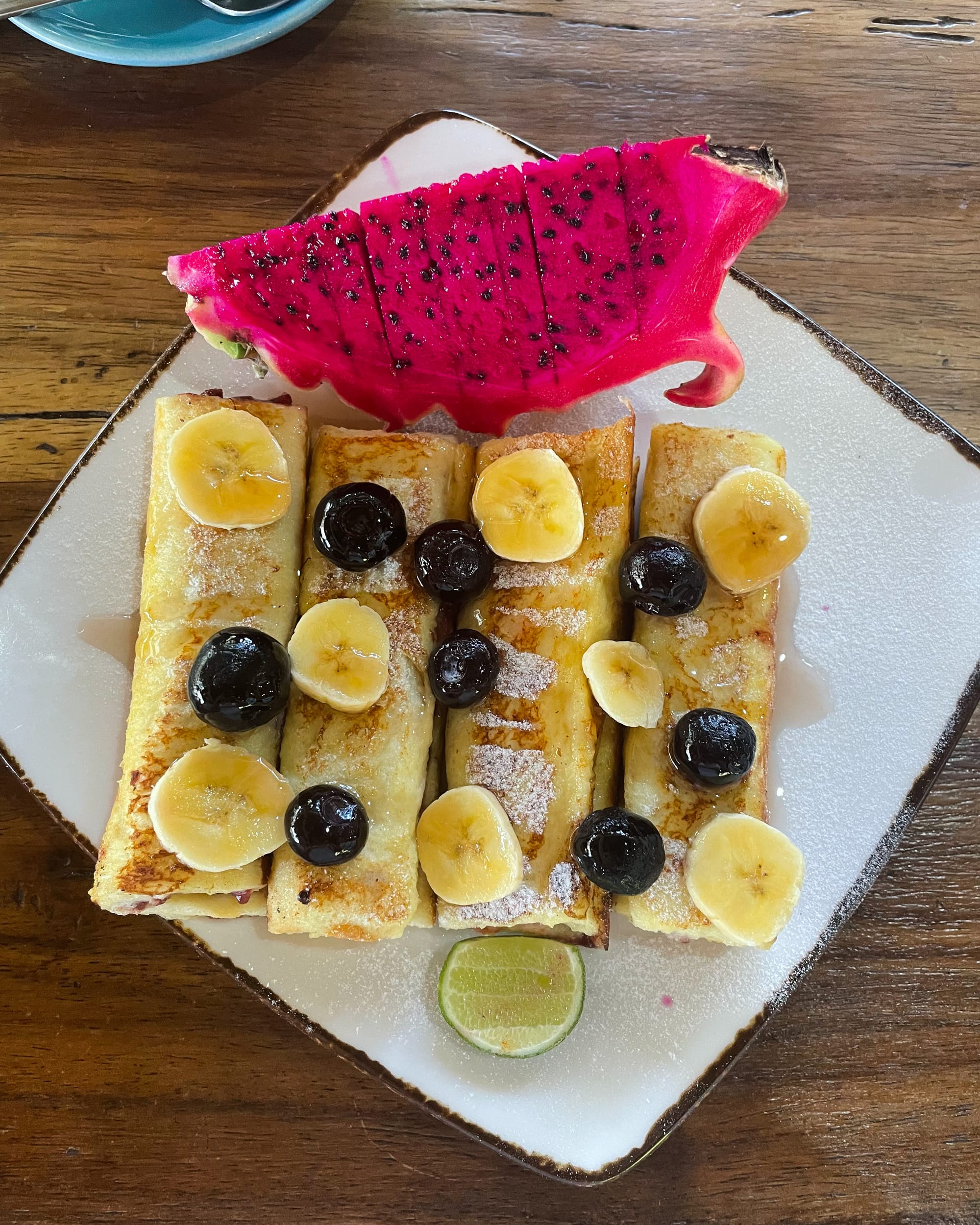french toast roll-ups with banana and blueberrys at gili coffee roasters
