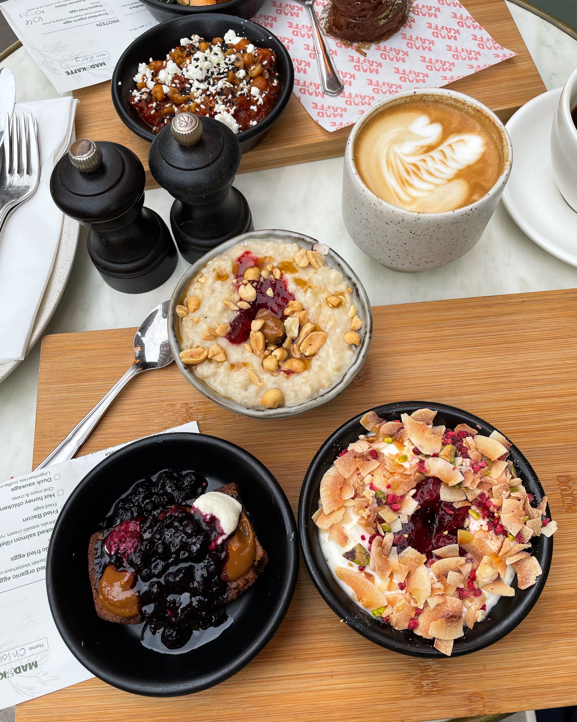 colourful brunch plates on a wooden board  at Mad & kaffee copenhagen
