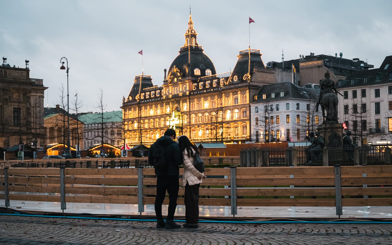 Magasin du Nord lit up in yellow lights in copenhagen