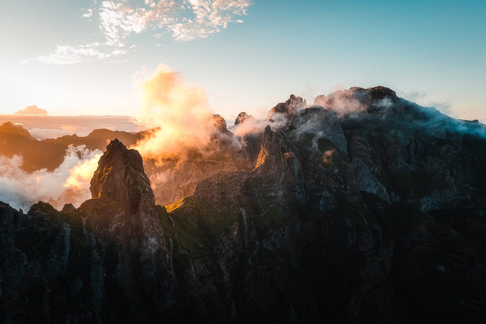 Mountain view above the clouds from PR1 hiking trail in Madeira at sunset